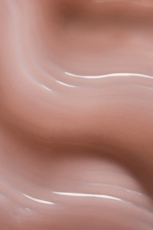 Warm nude-pink swirl of Peptint's tinted lip treatment texture