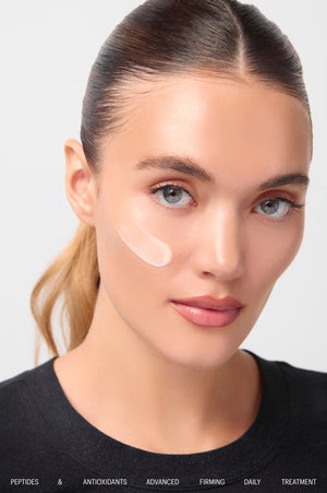 Model with Firming Daily Treatment cream swatch on cheek