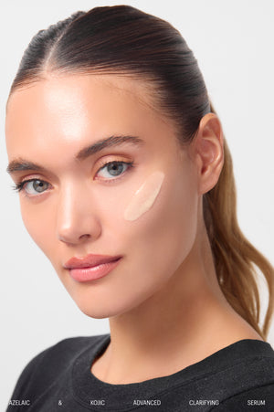 Model with Azelaic & Kojic Serum texture swatch on cheek