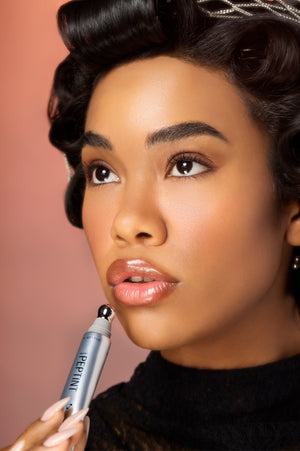 Model applying Peptint lip treatment in shade Utopia to her lips
