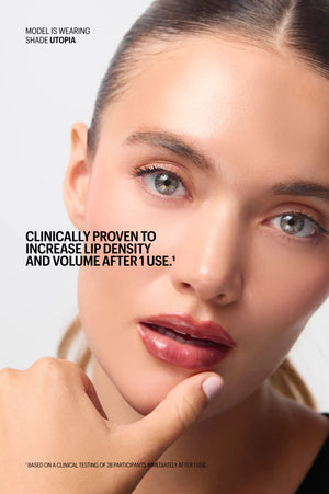 Model wearing Peptint in shade Utopia, for fuller-looking lips