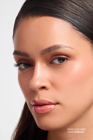 Model wearing Peptint Lip Treatment in Fearless shade